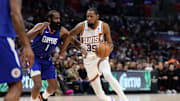 Jan 8, 2024; Los Angeles, California, USA;  Phoenix Suns forward Kevin Durant (35) dribbles the ball against Los Angeles Clippers guard James Harden (1) during the fourth quarter at Crypto.com Arena. Mandatory Credit: Kiyoshi Mio-Imagn Images