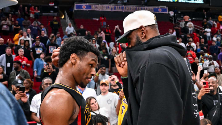 Mar 28, 2023; Houston, TX, USA; McDonald's All American West guard Bronny James (6) speaks with his father, LeBron James of the Los Angeles Lakers, after the game against the McDonald's All American East at Toyota Center. Mandatory Credit: Maria Lysaker-USA TODAY Sports