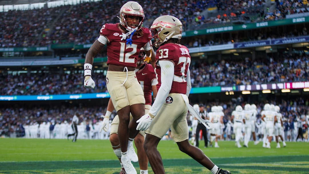 Aug 24, 2024; Dublin, IRL; Florida State University defensive back Edwin Joseph celebrates a tackle against Georgia Tech with defensive back Conrad Hussey at Aviva Stadium. Mandatory Credit: Tom Maher/INPHO via Imagn Images