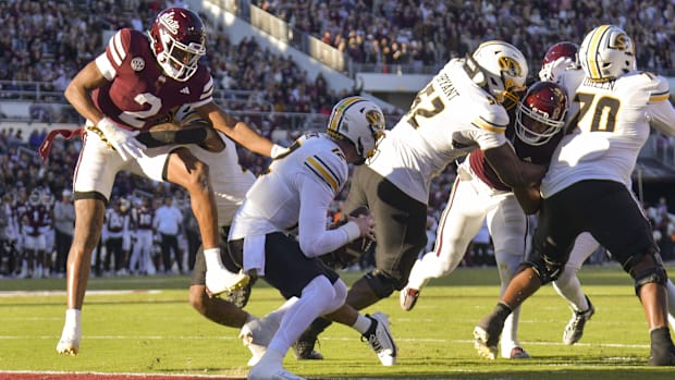 Mississippi State Bulldogs safety Isaac Smith (2) sacks Missouri Tigers quarterback Brady Cook 