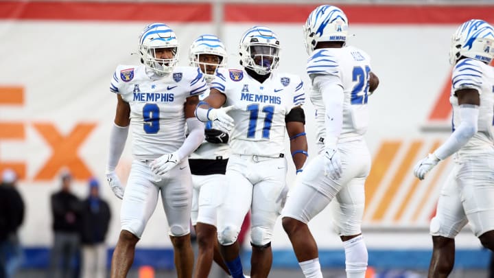 Dec 29, 2023; Memphis, TN, USA; Memphis Tigers linebacker Geoffrey Cantin-Arku (9) and Memphis Tigers linebacker Chandler Martin (11) react after a defensive stop during the first half against the Iowa State Cyclones at Simmons Bank Liberty Stadium. Mandatory Credit: Petre Thomas-USA TODAY Sports