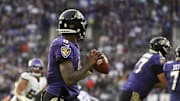 Nov 7, 2021; Baltimore, Maryland, USA; Baltimore Ravens quarterback Lamar Jackson (8) looks to pass from the pocket during the second half against the Minnesota Vikings  at M&T Bank Stadium. Mandatory Credit: Tommy Gilligan-Imagn Images