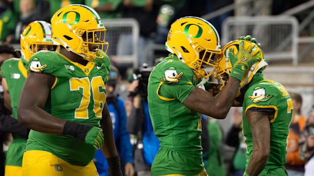 Oregon wide receiver Traeshon Holden and Oregon wide receiver Evan Stewart celebrate a touchdown