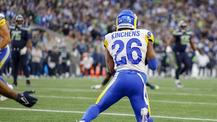 Nov 3, 2024; Seattle, Washington, USA; Los Angeles Rams safety Kamren Kinchens (26) intercepts a pass in the end zone against the Seattle Seahawks during the fourth quarter at Lumen Field. Kinchens would go on to return the interception for a touchdown. Mandatory Credit: Joe Nicholson-Imagn Images