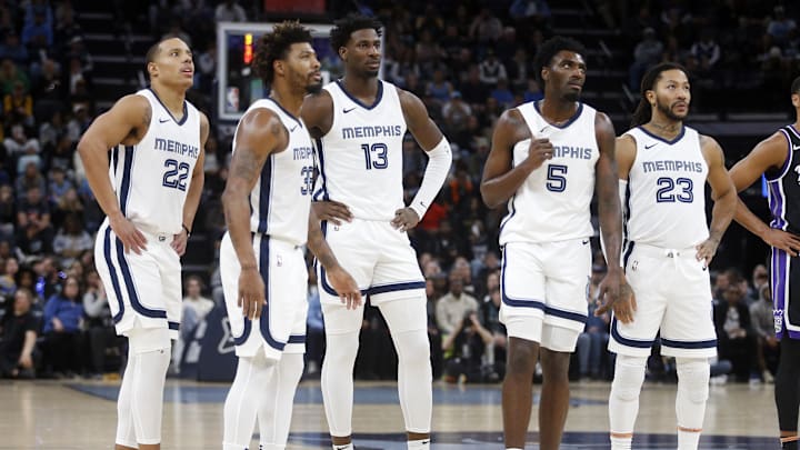 Dec 31, 2023; Memphis, Tennessee, USA; Memphis Grizzlies guard Desmond Bane (22), guard Marcus Smart (36), forward-center Jaren Jackson Jr. (13), guard Vince Williams Jr. (5) and guard Derrick Rose (23) watch as the Sacramento Kings shoot a technical free throw during the first half at FedExForum. Mandatory Credit: Petre Thomas-Imagn Images