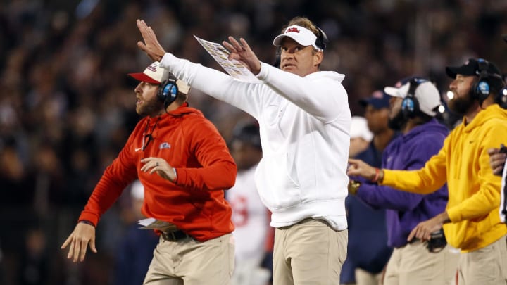 Nov 23, 2023; Starkville, Mississippi, USA; Mississippi Rebels head coach Lane Kiffin signals during the first half against the Mississippi State Bulldogs at Davis Wade Stadium at Scott Field. Mandatory Credit: Petre Thomas-USA TODAY Sports