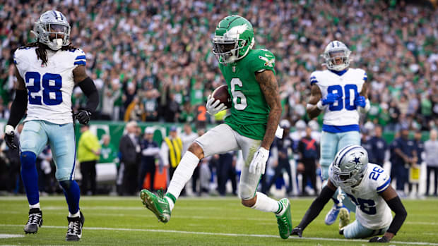 Philadelphia Eagles wide receiver DeVonta Smith runs past Dallas Cowboys cornerback DaRon Bland for a touchdown