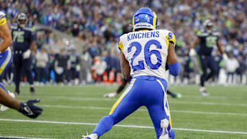 Nov 3, 2024; Seattle, Washington, USA; Los Angeles Rams safety Kamren Kinchens (26) intercepts a pass in the end zone against the Seattle Seahawks during the fourth quarter at Lumen Field. Kinchens would go on to return the interception for a touchdown. Mandatory Credit: Joe Nicholson-Imagn Images
