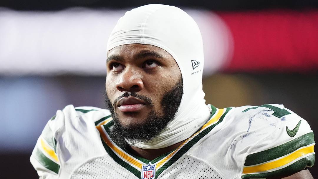 Dec 14, 2025; Denver, Colorado, USA; Green Bay Packers defensive end Micah Parsons (1) walks off the field with help from medical personnel following an injury during the third quarter against the Denver Broncos at Empower Field at Mile High. Mandatory Credit: Ron Chenoy-Imagn Images