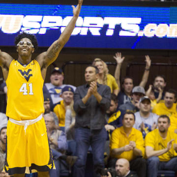 West Virginia Mountaineers forward Devin Williams (41) celebrates after a defensive stop during the second half against the Baylor Bears at the WVU Coliseum. 