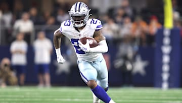 Dec 22, 2024; Arlington, Texas, USA; Dallas Cowboys running back Rico Dowdle (23) runs the ball against the Tampa Bay Buccaneers in the second half at AT&T Stadium.