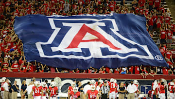 Oct. 20, 2012; Tucson, AZ, USA; Arizona Wildcats fans in the grandstands display a flag in the crowd against the Washington Huskies at Arizona Stadium. Mandatory Credit: Mark J. Rebilas-Imagn Images