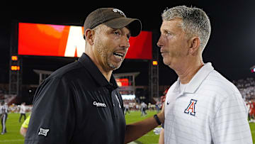 Iowa State football coach Matt Campbell gets congratulation from Arizona football coach Brent Brennan after winning over Arizona in the Big-12 conference showdown on Sept. 27, 2025, at Jack Trice Stadium in Ames, Iowa.