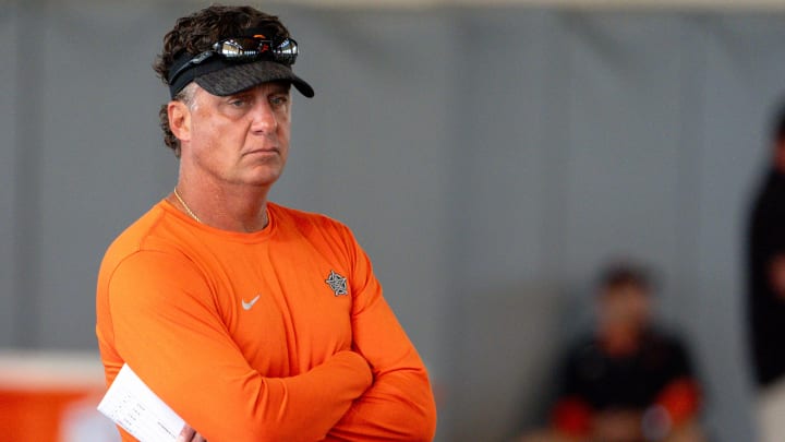 Head coach Mike Gundy walks on the field during an Oklahoma State football practice in Stillwater, Okla., on Saturday, Aug. 3, 2024.