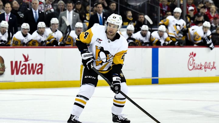 Apr 11, 2025; Newark, New Jersey, USA; Pittsburgh Penguins defenseman Matt Grzelcyk (24) controls the puck during the third period against the New Jersey Devils at Prudential Center. Mandatory Credit: John Jones-Imagn Images Apr 11, 2025; Newark, New Jersey, USA; Pittsburgh Penguins defenseman Matt Grzelcyk (24) controls the puck during the third period against the New Jersey Devils at Prudential Center. Mandatory Credit: John Jones-Imagn Images