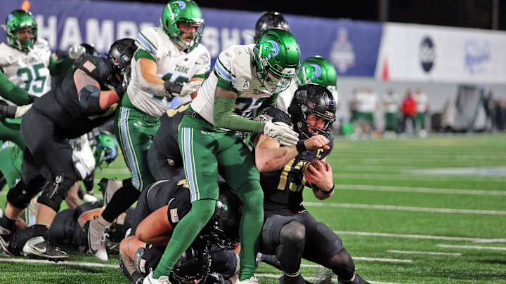 Dec 6, 2024; West Point, NY, USA; Army Black Knights quarterback Bryson Daily (13) runs for a touchdown against the Tulane Green Wave during the first half at Michie Stadium. Dec 6, 2024; West Point, NY, USA; Army Black Knights quarterback Bryson Daily (13) runs for a touchdown against the Tulane Green Wave during the first half at Michie Stadium.