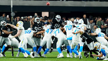 Dec 14, 2023; Paradise, Nevada, USA;  Los Angeles Chargers place kicker Cameron Dicker (11) kicks a field goal against the Las Vegas Raiders in the third quarter at Allegiant Stadium. Mandatory Credit: Stephen R. Sylvanie-Imagn Images