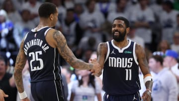 Dallas Mavericks guard Kyrie Irving (11) and forward P.J. Washington (25) celebrate.