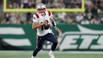 Sep 19, 2024; East Rutherford, New Jersey, USA; New England Patriots quarterback Drake Maye (10) runs with the ball against the New York Jets during the fourth quarter at MetLife Stadium. Mandatory Credit: Brad Penner-Imagn Images