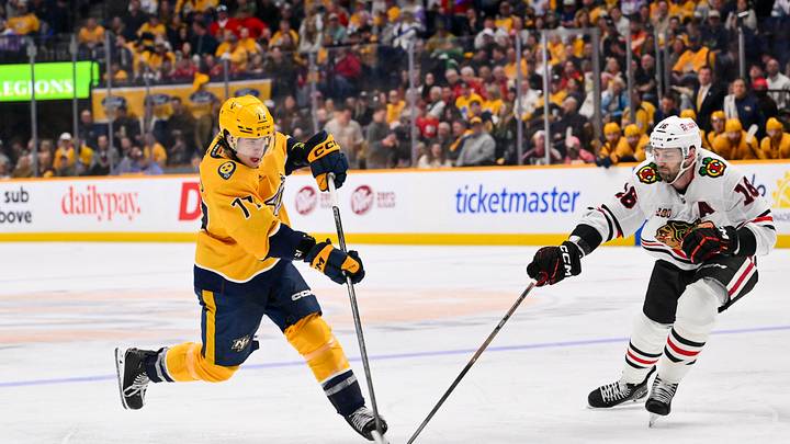 Feb 26, 2026; Nashville, Tennessee, USA;  Nashville Predators right wing Luke Evangelista (77) takes a shot on goal against the Chicago Blackhawks during the third period at Bridgestone Arena. Mandatory Credit: Steve Roberts-Imagn Images