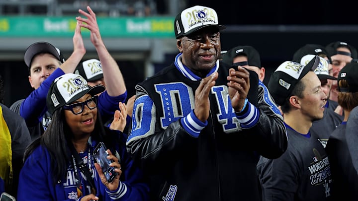 Los Angeles Dodgers owner Magic Johnson celebrates after the Los Angeles Dodgers beat the New York Yankees.