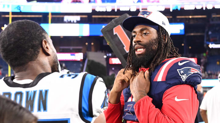 August 8, 2024; Foxborough, MA, USA;  New England Patriots linebacker Matthew Judon (9) speaks to Carolina Panthers cornerback Anthony Brown (35) after a game at Gillette Stadium. Mandatory Credit: Eric Canha-USA TODAY Sports