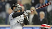 Chicago White Sox center fielder Michael A. Taylor (21) hits a two-run double against the Minnesota Twins at Target Field.