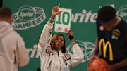 Mar 31, 2025; Brooklyn, New York, USA; Chicago Sky forward Angel Reese holds up a score card during the Sprite Jam Fest at Barclay's Center. 