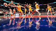 Indiana Fever guard Caitlin Clark rushes up the court against Los Angeles Sparks Odyssey Sims on Wednesday, Sept. 4, 2024, during the game at Gainbridge Fieldhouse in Indianapolis. The Indiana Fever defeated the Los Angeles Sparks, 93-86.