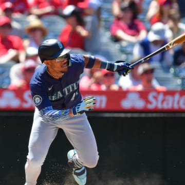 Seattle Mariners center fielder Julio Rodriguez (44) hits a single against the Los Angeles Angels during the sixth inning at Angel Stadium on July 14.