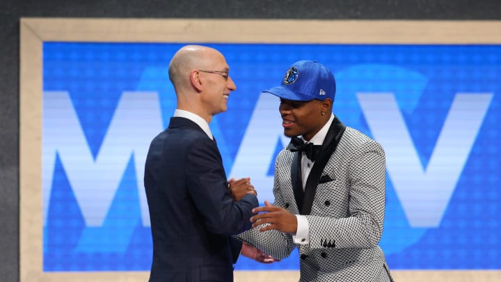 Jun 22, 2017; Brooklyn, NY, USA; Dennis Smith, Jr. (NC State) is introduced by NBA commissioner Adam Silver as the number nine overall pick to the Dallas Mavericks in the first round of the 2017 NBA Draft at Barclays Center. Mandatory Credit: Brad Penner-USA TODAY Sports