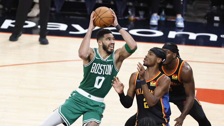 Jan 5, 2025; Oklahoma City, Oklahoma, USA;Boston Celtics forward Jayson Tatum (0) shoots the ball over Oklahoma City Thunder guard Shai Gilgeous-Alexander (2) during the third quarter at Paycom Center. Mandatory Credit: Alonzo Adams-Imagn Images Jan 5, 2025; Oklahoma City, Oklahoma, USA;Boston Celtics forward Jayson Tatum (0) shoots the ball over Oklahoma City Thunder guard Shai Gilgeous-Alexander (2) during the third quarter at Paycom Center. Mandatory Credit: Alonzo Adams-Imagn Images