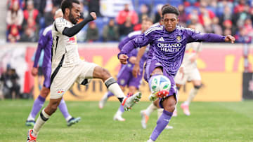 Mar 15, 2025; Harrison, New Jersey, USA; Orlando City defender Rafael Santos (3) plays the ball in front of New York Red Bulls defender Raheem Edwards (44) during the second half at Sports Illustrated Stadium. Mandatory Credit: Vincent Carchietta-Imagn Images