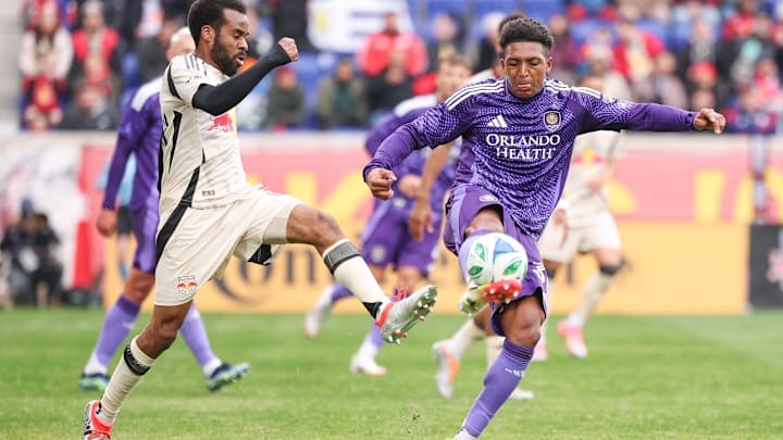 Mar 15, 2025; Harrison, New Jersey, USA; Orlando City defender Rafael Santos (3) plays the ball in front of New York Red Bulls defender Raheem Edwards (44) during the second half at Sports Illustrated Stadium. Mandatory Credit: Vincent Carchietta-Imagn Images