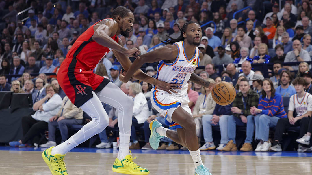Feb 7, 2026; Oklahoma City, Oklahoma, USA; Oklahoma City Thunder guard Cason Wallace (22) drives past Houston Rockets forward Kevin Durant (7) during the first half at Paycom Center. Mandatory Credit: Alonzo Adams-Imagn Images