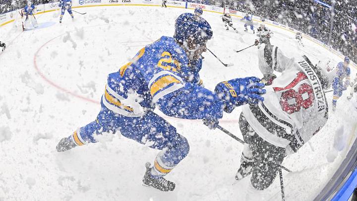 Oct 9, 2025; St. Louis, Missouri, USA; St. Louis Blues defenseman Logan Mailloux (23) skates against Minnesota Wild center Vinnie Hinostroza (18) after they sprayed ice in the air during the third period at Enterprise Center. Mandatory Credit: Jeff Curry-Imagn Images
