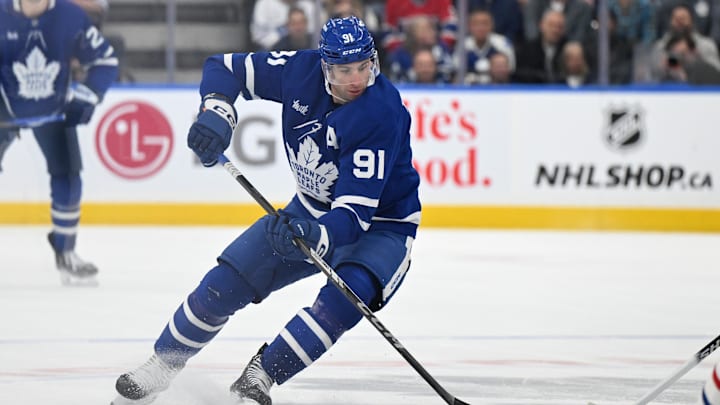 Apr 12, 2025; Toronto, Ontario, CAN;  Toronto Maple Leafs forward John Tavares (91) skates with the puck against the Montreal Canadiens in the first period at Scotiabank Arena. Mandatory Credit: Dan Hamilton-Imagn Images
