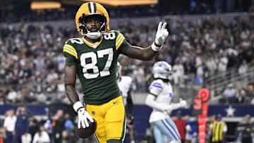 Green Bay Packers wide receiver Romeo Doubs (87) celebrates after scoring a touchdown against the Dallas Cowboys in the fourth quarter at AT&T Stadium.