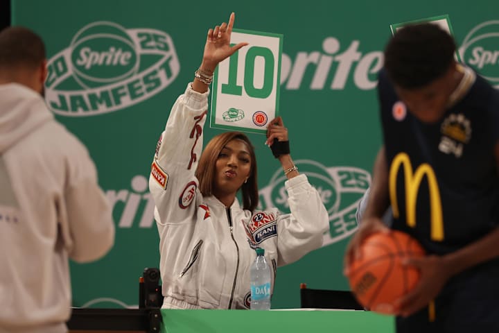 Chicago Sky forward Angel Reese holds up a score card during the Sprite Jam Fest.