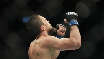 Mar 5, 2022; Las Vegas, Nevada, UNITED STATES; Umar Nurmagomedov (blue gloves) celebrates after defeating Brian Kelleher (not pictured) during UFC 272 at T-Mobile Arena. Mandatory Credit: Stephen R. Sylvanie-USA TODAY Sports