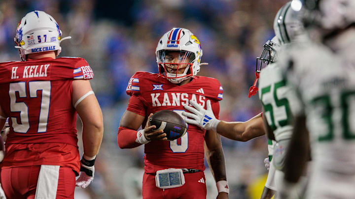 Aug 29, 2025; Lawrence, Kansas, USA; Kansas Jayhawks quarterback Isaiah Marshall (8) on the field during the second half against the Wagner Seahawks at David Booth Kansas Memorial Stadium. Mandatory Credit: William Purnell-Imagn Images
