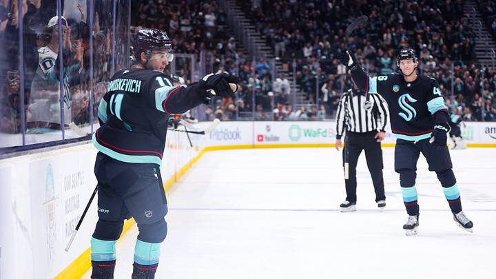 Oct 4, 2026; Seattle, Washington, USA; Seattle Kraken right wing Mackie Samoskevich (11) reacts after scoring a goal in the second period against the Calgary Flames at Climate Pledge Arena. Mandatory Credit: Kevin Ng-Imagn Images