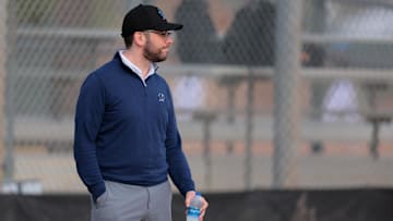 Feb 13, 2025; Jupiter, FL, USA; Miami Marlins president of baseball operations Peter Bendix looks on during a spring training workout at the Miami Marlins player development & scouting complex.