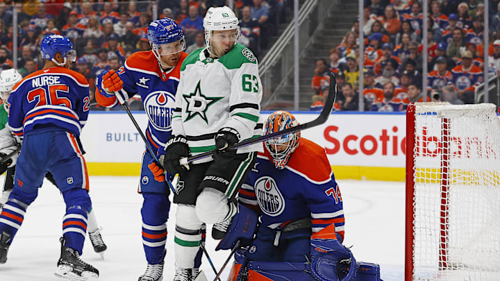 Mar 8, 2025; Edmonton, Alberta, CAN; Dallas Stars forward Evgenii Dadonov (63) tries to screen Edmonton Oilers goaltender Stuart Skinner (74) during the second period at Rogers Place. Mandatory Credit: Perry Nelson-Imagn Images