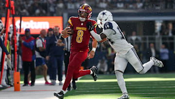 Oct 19, 2025; Arlington, Texas, USA; Dallas Cowboys safety Markquese Bell (14) pushes Washington Commanders quarterback Marcus Mariota (8) out of bounds during the third quarter of the game at AT&T Stadium. Mandatory Credit: Kevin Jairaj-Imagn Images
