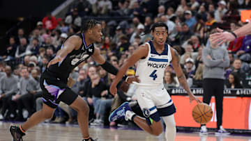Jan 30, 2025; Salt Lake City, Utah, USA; Minnesota Timberwolves guard Rob Dillingham (4) runs past Utah Jazz guard Isaiah Collier (13) during the second half at Delta Center. Mandatory Credit: Chris Nicoll-Imagn Images