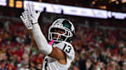 Sep 20, 2025; Los Angeles, California, USA; Michigan State Spartans wide receiver Chrishon McCray (13) celebrates his touchdown scored against the Southern California Trojans during the first half at the Los Angeles Memorial Coliseum. Mandatory Credit: Gary A. Vasquez-Imagn Images