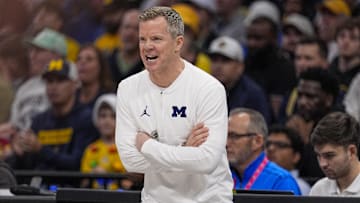 Dec 18, 2024; Charlotte, North Carolina, USA; Michigan Wolverines head coach Dusty May during the first half against the Oklahoma Sooners at Spectrum Center. Mandatory Credit: Jim Dedmon-Imagn Images