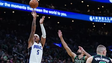 Apr 29, 2025; Boston, Massachusetts, USA; Orlando Magic forward Paolo Banchero (5) shoots the ball against Boston Celtics