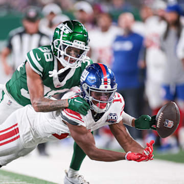 Aug 24, 2024; East Rutherford, New Jersey, USA; New York Jets defensive back Nehemiah Shelton (38) breaks up a pass intended for New York Giants wide receiver Ayir Asante (19) during the second half at MetLife Stadium. Mandatory Credit: Vincent Carchietta-Imagn Images